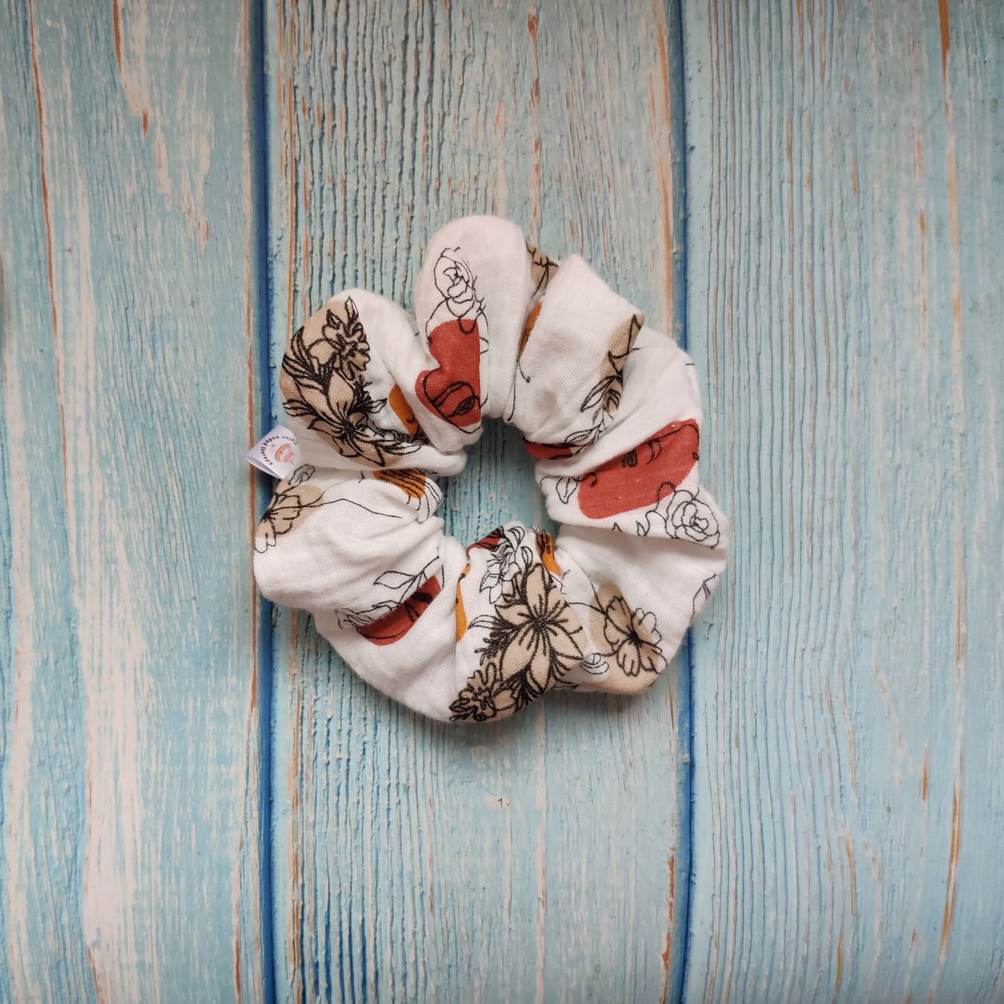 Feminine flowery scrunchie in copper