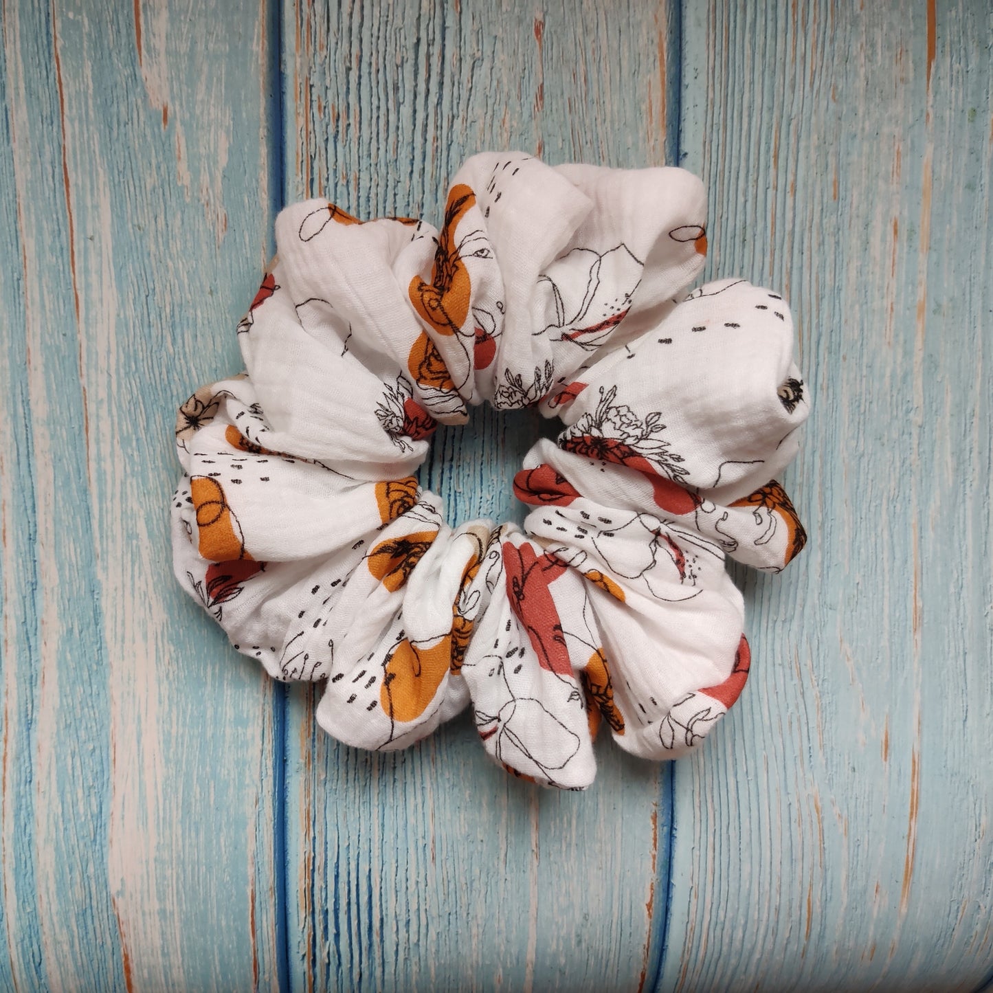 Feminine flowery scrunchie in copper
