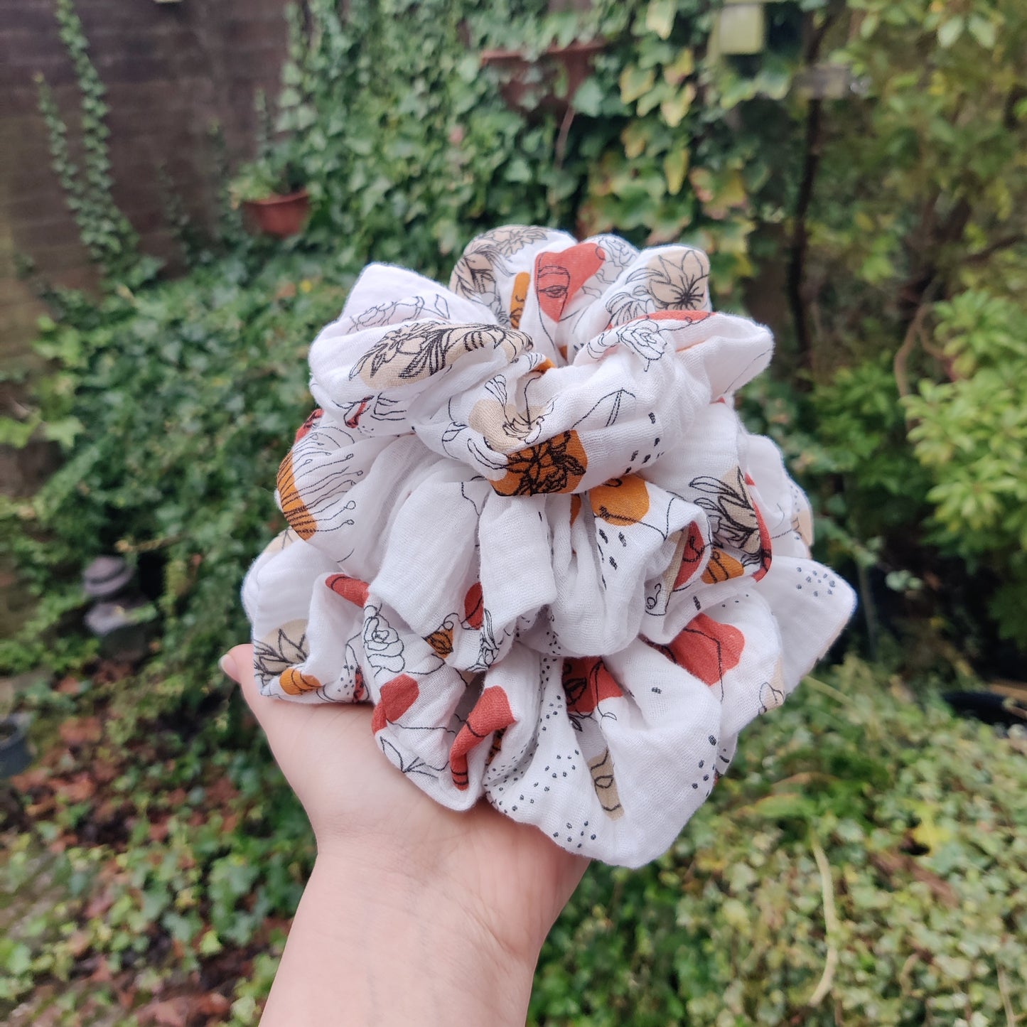 Feminine flowery scrunchie in copper