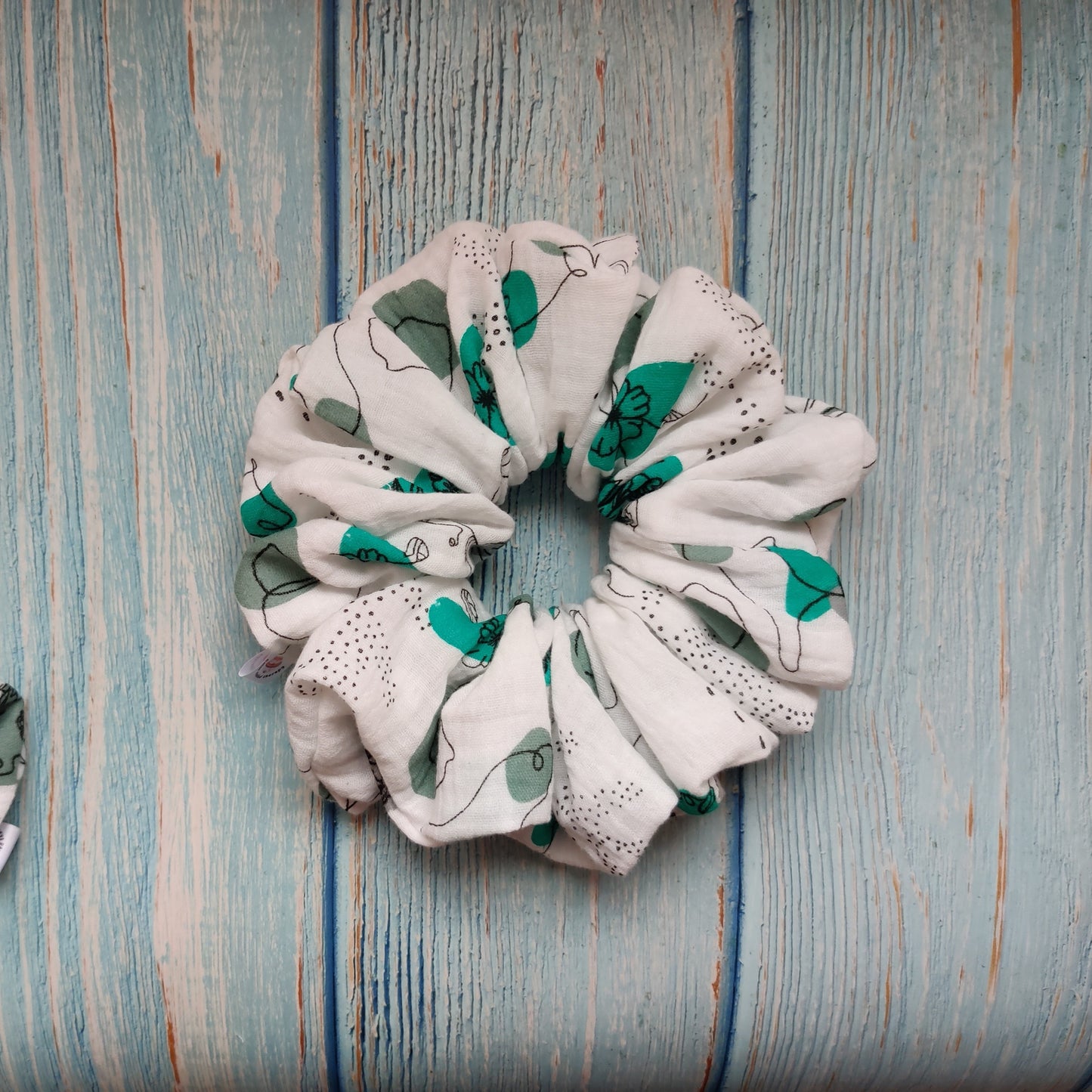 Feminine flowery scrunchie in green