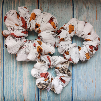 Feminine flowery scrunchie in copper